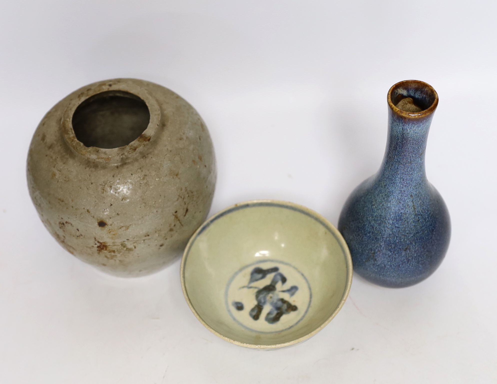 A Chinese Shiwan vase, a jar and a blue and white bowl, largest 18cm high